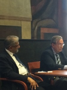Professor Constantine Michalopoulos speaks while former UN official Khalid Malik looks on